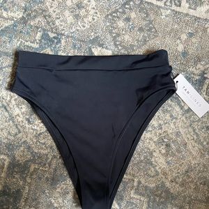 Tan lines high waisted black suit